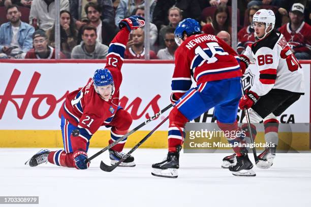Kaiden Guhle of the Montreal Canadiens reaches for the puck during the second period against the New Jersey Devils at the Bell Centre on September...