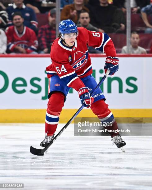 David Reinbacher of the Montreal Canadiens skates the puck during the second period against the New Jersey Devils at the Bell Centre on September 25,...