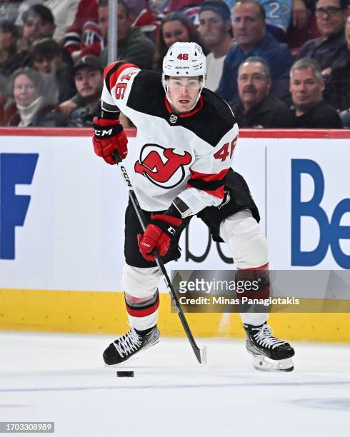 Max Willman of the New Jersey Devils skates the puck during the first period against the Montreal Canadiens at the Bell Centre on September 25, 2023...