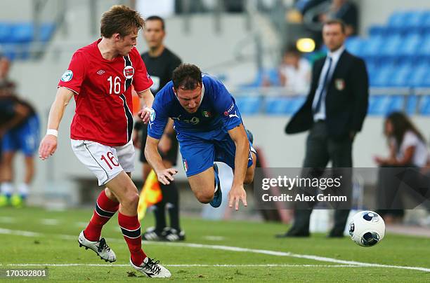 Vasco Regini of Italy is challenged by Yann-Erik de Lanlay of Norway during the UEFA European U21 Championship Group A match between Norway and Italy...