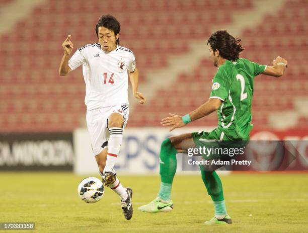 Kengo Nakamura of Japan controls the ball during the FIFA World Cup Asian qualifier match between Iraq and Japan at Al-Arabi Stadium on June 11, 2013...