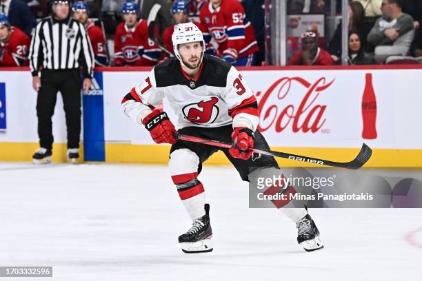 Justin Dowling of the New Jersey Devils skates during the third period against the Montreal Canadiens at the Bell Centre on September 25, 2023 in...