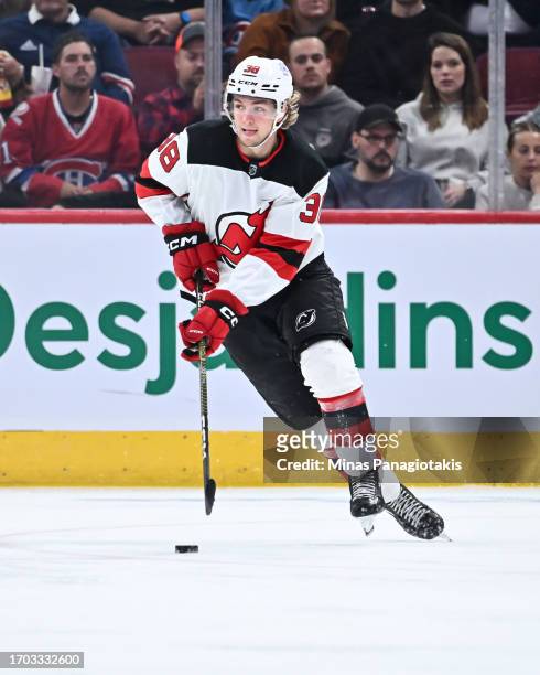 Topias Vilen of the New Jersey Devils skates the puck during the third period against the Montreal Canadiens at the Bell Centre on September 25, 2023...