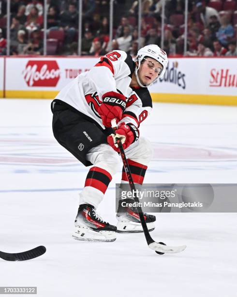 Jack Hughes of the New Jersey Devils controls the puck during the third period against the Montreal Canadiens at the Bell Centre on September 25,...