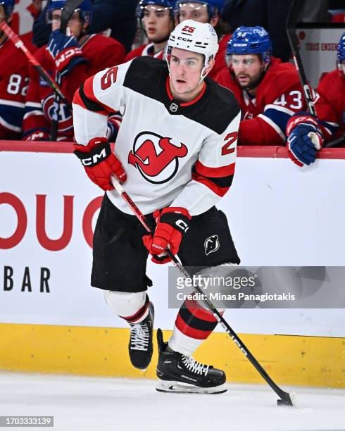 Nolan Foote of the New Jersey Devils skates the puck during the third period against the Montreal Canadiens at the Bell Centre on September 25, 2023...