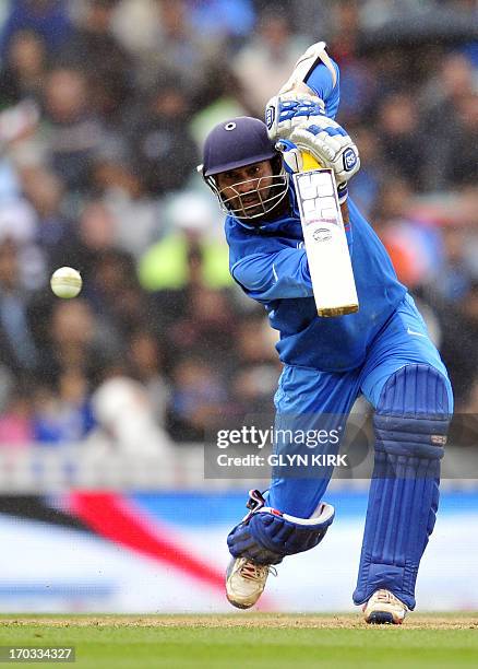 India's Dinesh Karthik plays a shot during the 2013 ICC Champions Trophy One Day International cricket match between India and West Indies at The...