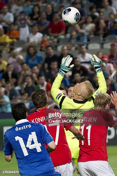 Norway's goalkeeper Arild Ostbo jumps to catch the ball following an attempt by Italy to score during the 2013 UEFA U-21 Championship group A...