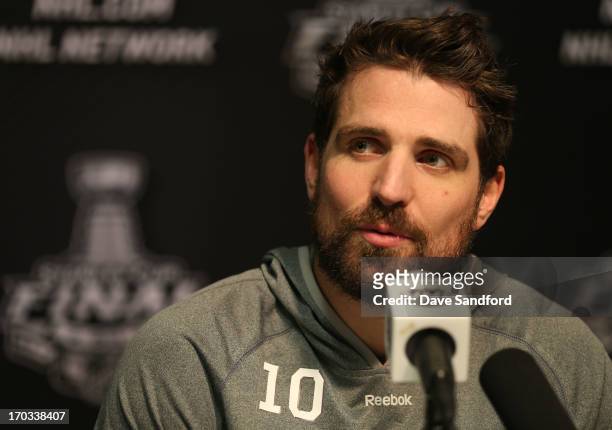 Patrick Sharp of the Chicago Blackhawks talks with reporters during the 2013 Stanley Cup Final Media Day at the United Center on June 11, 2013 in...