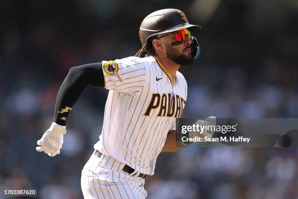 Fernando Tatis Jr. #23 of the San Diego Padres runs to first base during a game against the Colorado Rockies at PETCO Park on September 20, 2023 in...