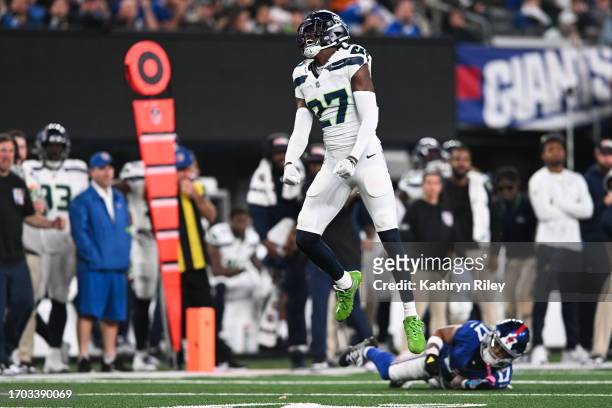 Riq Woolen of the Seattle Seahawks reacts after a defensive stop during the first half against the New York Giants at MetLife Stadium on October 2,...