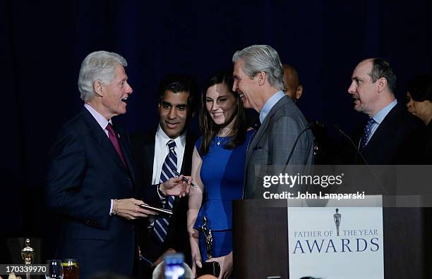 Terry J. Lundgren, Tracy Lundgren, Former President of the United States Bill Clinton attend the 72nd Annual Father Of The Year Awards at the Grand...