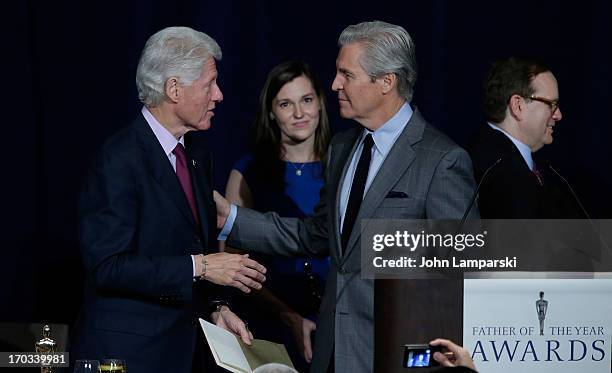 Terry J. Lundgren, Tracy Lundgren, Former President of the United States Bill Clinton attend the 72nd Annual Father Of The Year Awards at the Grand...