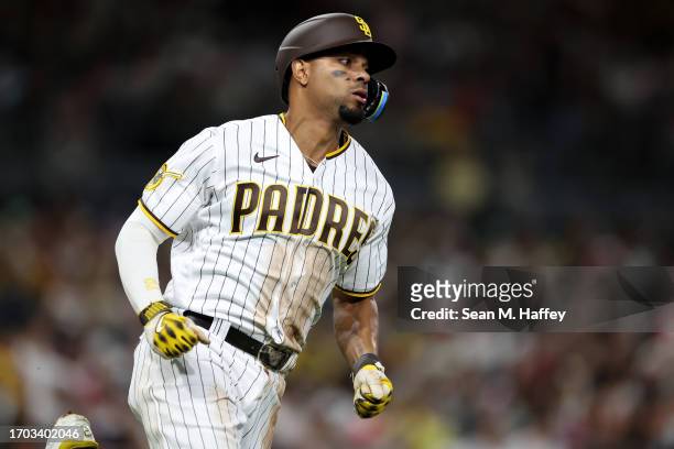 Xander Bogaerts of the San Diego Padres runs to first base during a game against the Colorado Rockies at PETCO Park on September 18, 2023 in San...