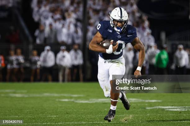 Nicholas Singleton of the Penn State Nittany Lions carries the ball against the Iowa Hawkeyes during the first half at Beaver Stadium on September...