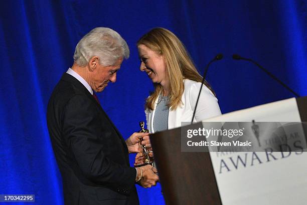 Former U.S. President Bill Clinton and daughter Chelsea Clinton attend 72nd Annual Father Of The Year Awards at Grand Hyatt New York on June 11, 2013...