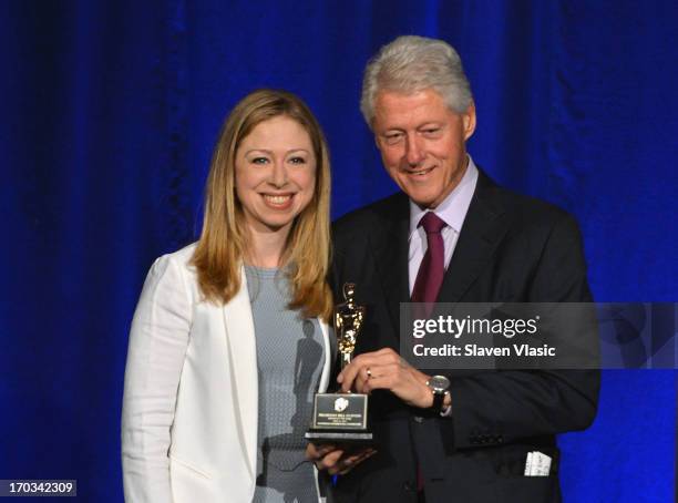 Former U.S. President Bill Clinton and daughter Chelsea Clinton attend 72nd Annual Father Of The Year Awards at Grand Hyatt New York on June 11, 2013...