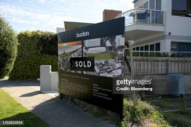 Sold" sticker covers a sale sign in the suburb of Brighton in Melbourne, Australia, on Monday, Oct. 2, 2023. Australian home prices stayed strong in...
