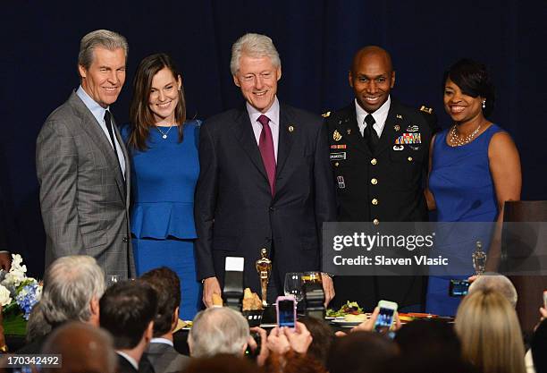 Terry J. Lundgren, Tracey Lundgren, former U.S. President Bill Clinton, Major Jackson Drumgoole ll and wife attend 72nd Annual Father Of The Year...