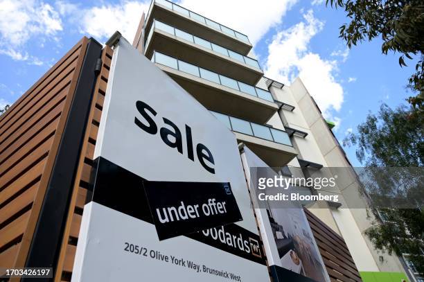 An "under offer" sticker covers a sale sign on an apartment complex in the Brunswick West area of Melbourne, Australia, on Monday, Oct. 2, 2023....