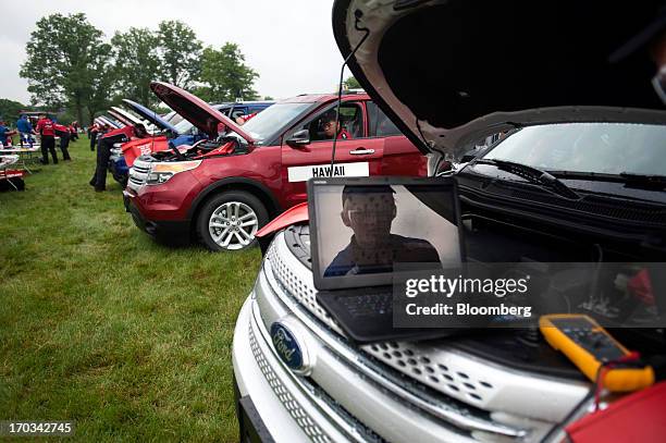 Student looks over diagnostic information on a laptop while repairing a Ford Motor Co. Explorer at the National Finals of the Annual Ford/AAA Student...