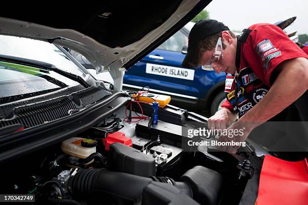 Student works under the hood of a Ford Motor Co. Explorer at the National Finals of the Annual Ford/AAA Student Auto Skills Competition at the Ford...