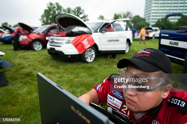 Student looks over diagnostic information on a laptop while repairing a Ford Motor Co. Explorer at the National Finals of the Annual Ford/AAA Student...