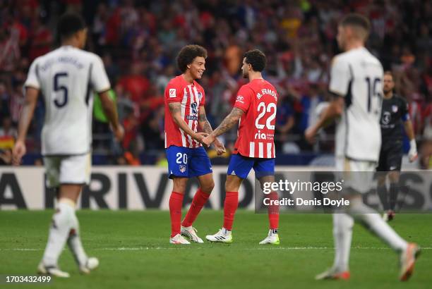 Axel Witsel and Mario Hermoso of Atletico de Madrid celebrate victory at the end of the LaLiga EA Sports match between Atletico Madrid and Real...