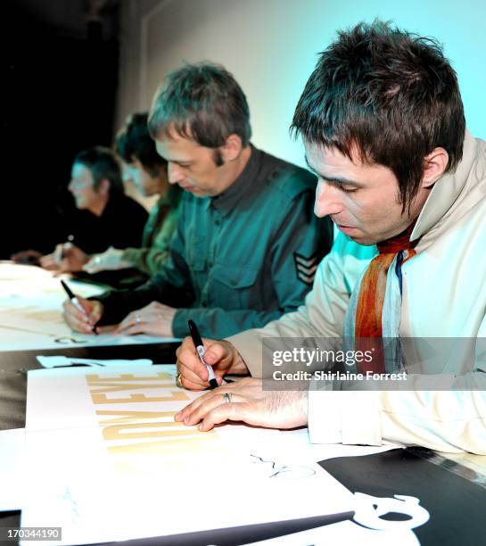 Chris Sharrock, Gem Archer, Andy Bell and Liam Gallagher of Beady Eye meet fans at an in-store appearance at HMV on June 11, 2013 in Manchester,...