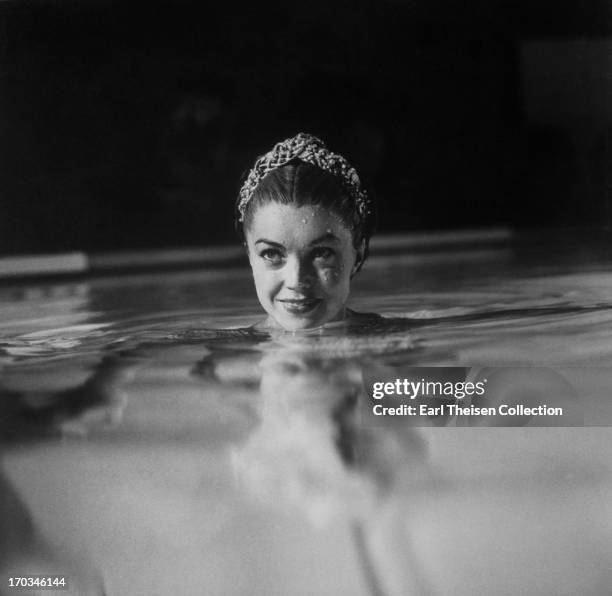 Swimming movie star Esther Williams on the set of Jupiter's Darling filmed in the pool specially construced for her in Stage 30 on the MGM lot in...