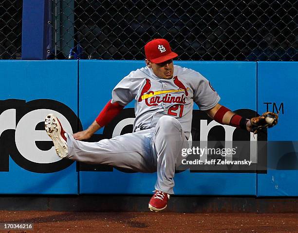 Allen Craig of the St. Louis Cardinals catches a long fly ball off the bat of Marlon Byrd of the New York Mets at Citi Field on June 11, 2013 in the...