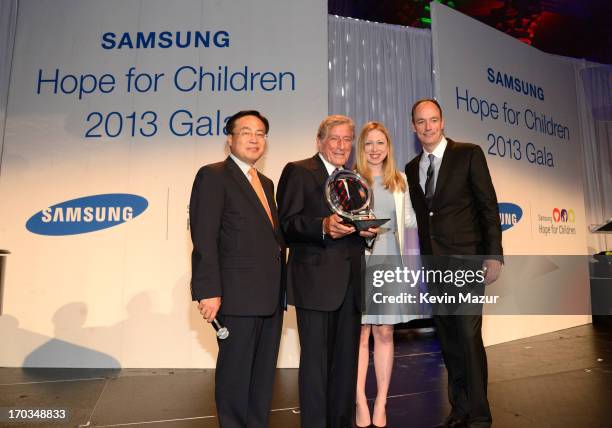 Of Samsung Electronics America YK Kim, Tony Bennett, Chelsea Clinton and President of Samsung Electronics America Tim Baxter on stage at the...