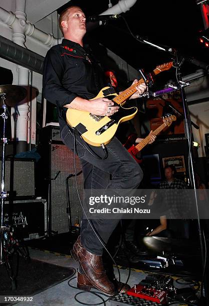 Josh Homme of Queens of the Stone Age performs at Rough Trade East on June 11, 2013 in London, England.
