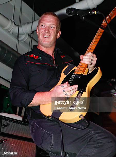 Josh Homme of Queens of the Stone Age performs at Rough Trade East on June 11, 2013 in London, England.