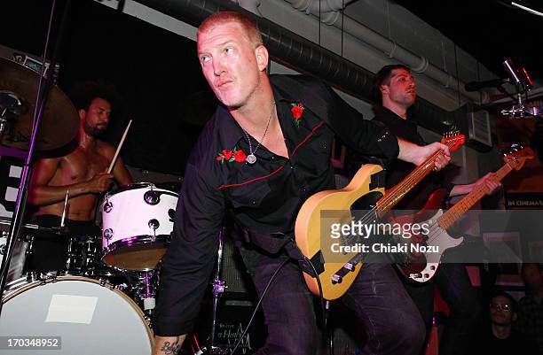 Jon Theodore, Josh Homme and Michael Shuman of Queens of the Stone Age perform at Rough Trade East on June 11, 2013 in London, England.