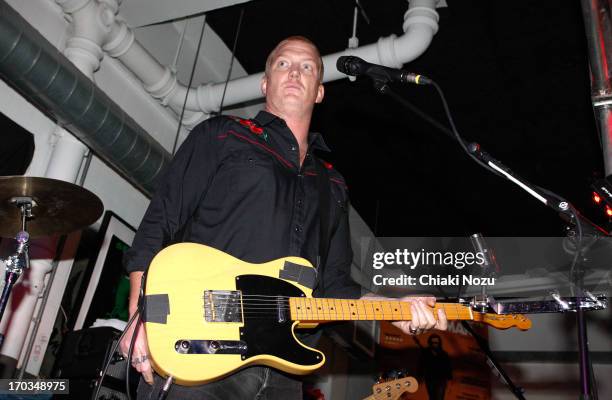 Josh Homme of Queens of the Stone Age performs at Rough Trade East on June 11, 2013 in London, England.