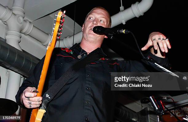 Josh Homme of Queens of the Stone Age performs at Rough Trade East on June 11, 2013 in London, England.
