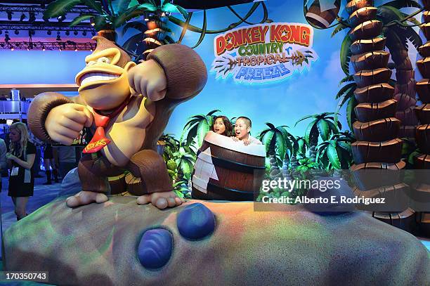 Fans enjoy the Nintendo Donkey Kong display at the E3 Gaming and Technology Conference at the Los Angeles Convention Center on June 11, 2013 in Los...