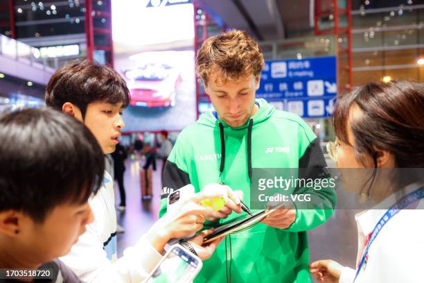 Casper Ruud of Norway sign autograph for fans as he arrives in Beijing for 2023 China Open on September 26, 2023 in Beijing, China.
