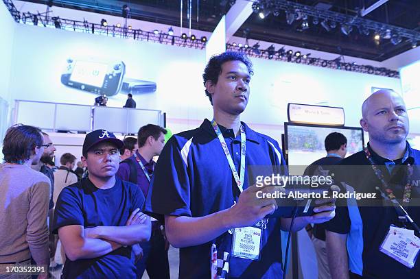 Fan tries out a Nintendo DS at the E3 Gaming and Technology Conference at the Los Angeles Convention Center on June 11, 2013 in Los Angeles,...