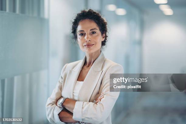 portrait of a middle age businesswoman - businesswear stock pictures, royalty-free photos & images