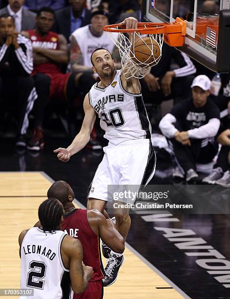 Manu Ginobili of the San Antonio Spurs dunks the ball in the second half while taking on the Miami Heat during Game Three of the 2013 NBA Finals at...