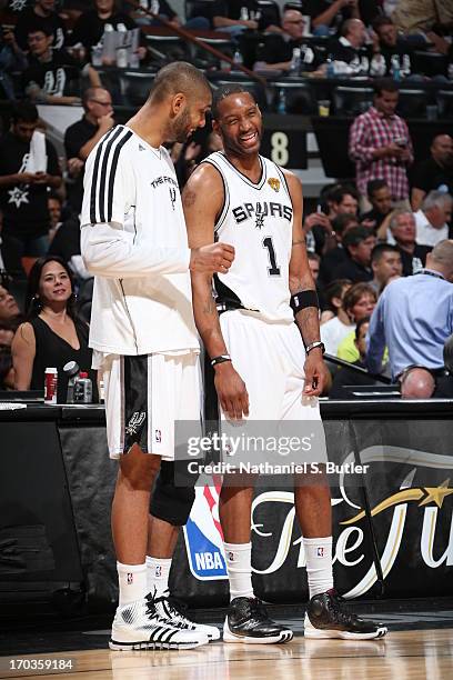 Teammates Tim Duncan and Tracy McGrady of the San Antonio Spurs while playing against the Miami Heat in Game Three of the 2013 NBA Finals on June 11,...