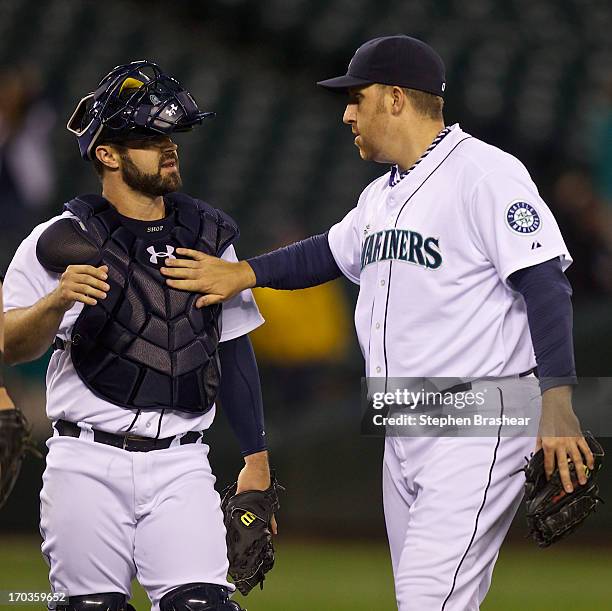 Aaron Harang, right, of the Seattle Mariners and Kelly Shoppach of the Seattle Mariners celebrate Harang's two-hit shutout of the Houston Astros at...