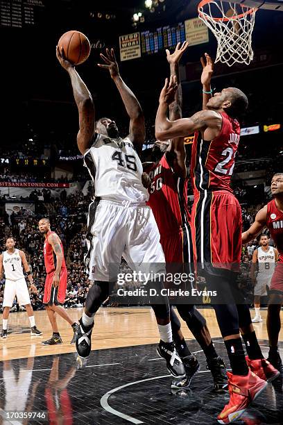 DeJuan Blair of the San Antonio Spurs shoots in the lane against Joel Anthony and James Jones of the Miami Heat during Game Three of the 2013 NBA...