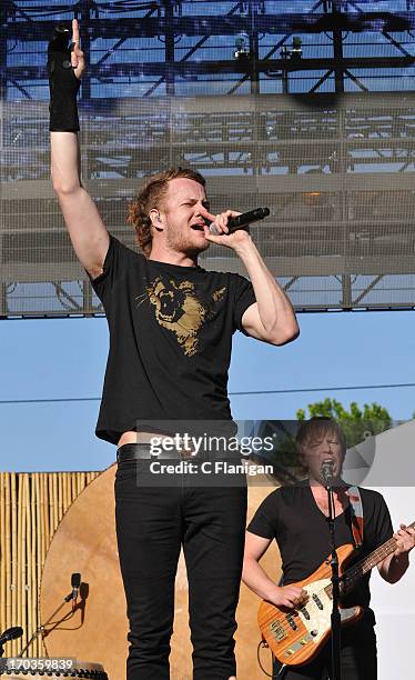 Dan Reynolds and Ben McKee of Imagine Dragons perform during the 21st annual KROQ Weenie Roast at Verizon Wireless Amphitheater on May 18, 2013 in...