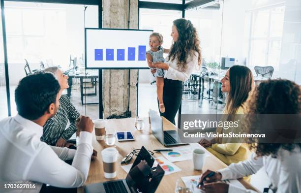 businesswoman and her child on a business meeting. - children looking graph stock pictures, royalty-free photos & images