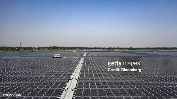 Floating solar farm of Sungrow Power Supply Co., built on the site of a former coal mine, since filled with water, in Huainan, China, on Monday, May...