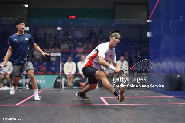 Henry Leung Chi-Hin of Team Chinese Hong Kong competes against Lee Min-woo of Team South Korea in the Squash - Men's Team Pool B on day three of the...