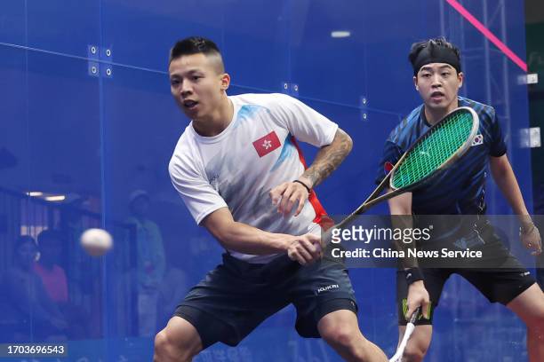 Lau Tsz Kwan of Team Chinese Hong Kong competes against Yoo Jaejin of Team South Korea in the Squash - Men's Team Pool B on day three of the 19th...