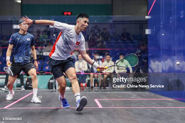 Tang Ming Hong of Team Chinese Hong Kong competes against Na Jooyoung of Team South Korea in the Squash - Men's Team Pool B on day three of the 19th...